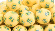 Melbourne couple $20 million richer after initially ignoring winning Powerball ticket stuck on their fridge door