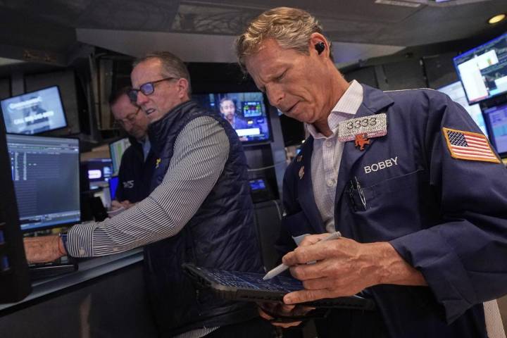 Wall Street ticks toward another record as Tesla vrooms higher