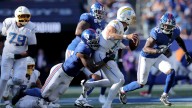 Giants pass rush sends Justin Herbert running for his life in Jaxson Dart debut