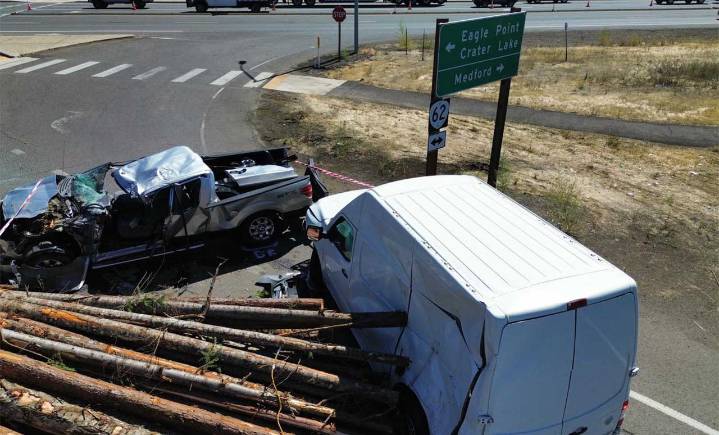 Overturned Log Truck in White City Crushes Three Vehicles and Leaves Two Drivers Injured