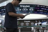 Asian shares are mixed and gold sets a fresh record high of over $3,550 per ounce