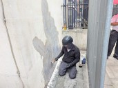 Banksy mural of UK judge hitting protester scrubbed from London court wall