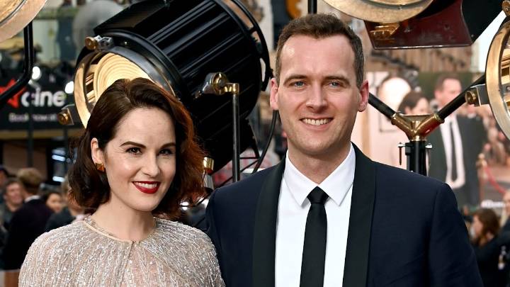 Downton Abbey star Michelle Dockery debuts baby bump alongside husband Jasper Waller