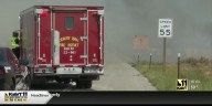 Brush fire burning near I