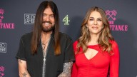 Billy Ray Cyrus teaches Elizabeth Hurley guitar as romance blossoms happily