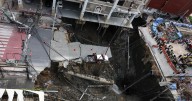Massive sinkhole swallows part of a Bangkok road, forcing evacuations in Thailand's capital
