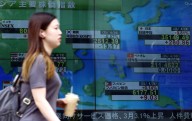 Shares cautious in Asia as US government faces shutdown risk