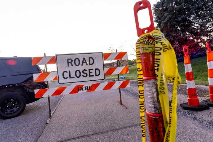 Man arrested after driving through barricade at Michigan church shooting site