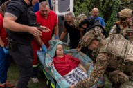 Russian glide bomb attack in eastern Ukraine kills at least 24 people waiting to collect pensions