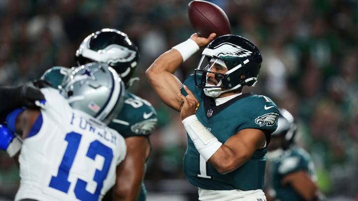 Defending champion Eagles edge Cowboys in wild, lightning