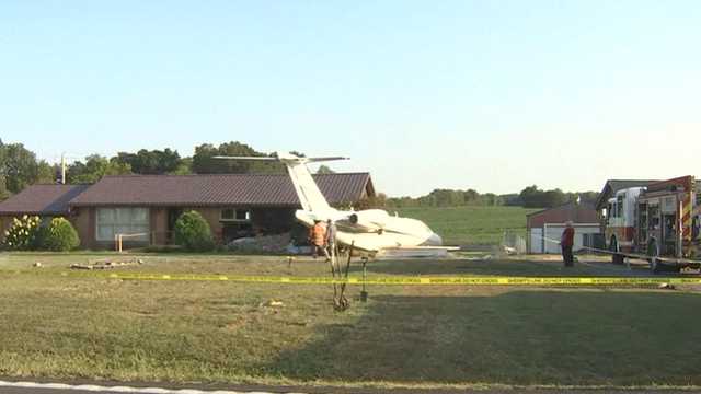 Plane crashes into home after landing in Kentucky