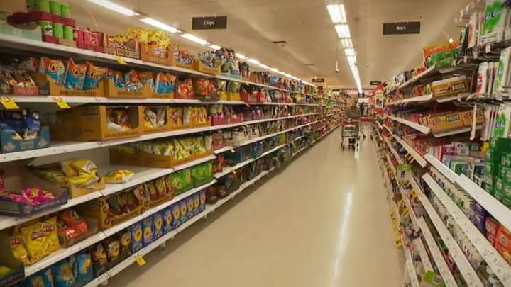 Woman in hospital after alleged attack inside Coles