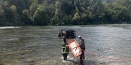 Driver rescued after crashing truck into river