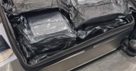 Sydney Airport: American plane passenger allegedly had 20kg of coke packed in her suitcase