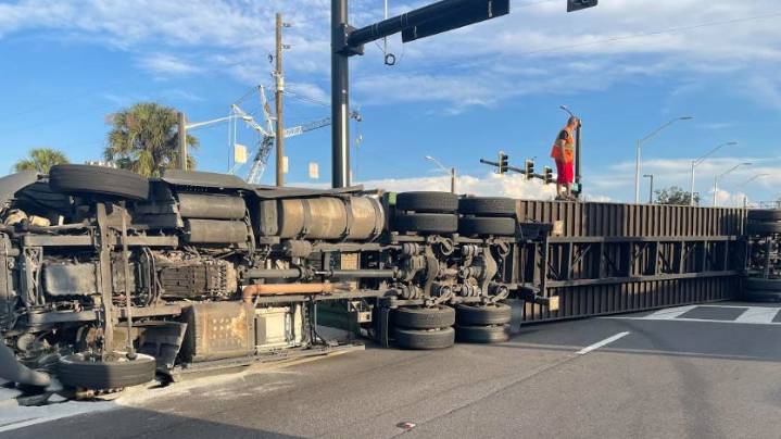 Ocala: Big rig driver unhurt; truck crashes onto its side