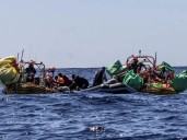 At least 50 dead after refugee boat catches fire off Libya