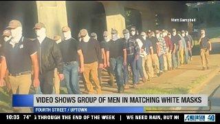 Video of masked men walking near Uptown draws attention