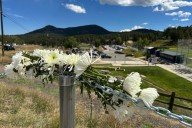 Authorities say student who had been radicalized fired revolver at Colorado school, wounding 2
