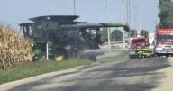 Combine and bean field catch fire in Clinton, 1 person sent to hospital