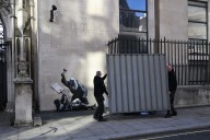 Watch: Banksy fans fight back over covering-up of new London artwork as screen pulled away