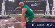 Aussie discus king slips in torrential rain