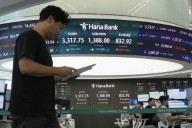 World shares are mostly up after US stocks inch to more records as inflation slows and Oracle soars