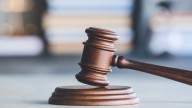 Woman 75th to be charged in largest COVID