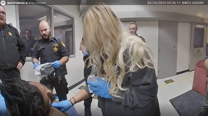 Ohio county agrees to $7M settlement over man's death after jail guards restrained him, family says