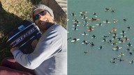 Thousands gather to honour shark attack victim Mercury Psillakis at Dee Why in Sydney