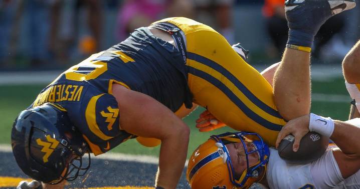 PHOTOS: West Virginia completes comeback, beats Pitt in overtime to win Backyard Brawl