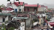 Deadly super storm with 83mph winds leaves nine dead and dozens missing as typhoon Bualoi hits Vietnam