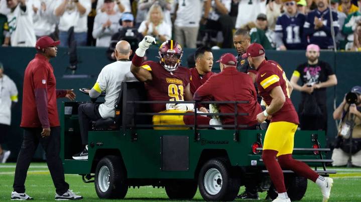 Commanders defensive end Deatrich Wise Jr. carted off the field with right quad injury vs. Packers