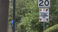 Strawberry Hill Neighborhood shows support for fallen KCK officer with blue ribbons