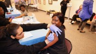 Eager COVID and flu vaccine recipients at Freeport mobile vaccine clinic