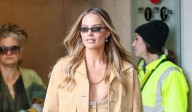 Margot Robbie Wears Low-Cut Top & Flared Jeans for London Press Appearance 