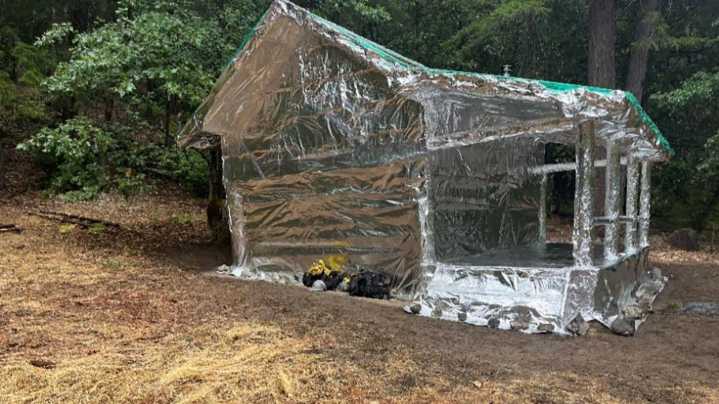 North State historic cabins in path of fire wrapped in…