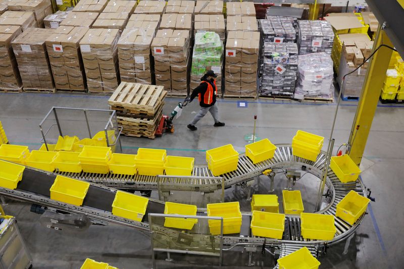 Amazon invests over $1 billion to raise employee pay, lower healthcare costs
