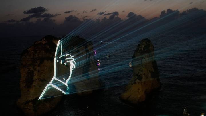 Hezbollah defies Lebanon PM's ban to honor fallen leaders with coastal light show