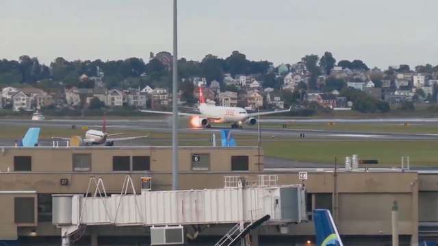 Flames shoot out of Swiss Airlines plane engine while on runway at Logan Airport