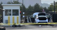 Driver rams car into FBI building gate, leaves US flag