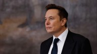 Elon Musk buys $1 billion worth of Tesla shares, a sign that he’s sticking around