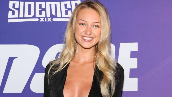 Viral ring girl Sydney Thomas wows as she goes braless in plunging dress at Inside by Sidemen launch