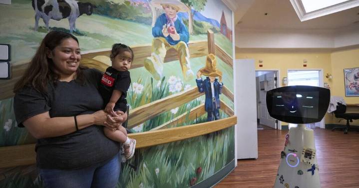 A robot programmed to act like a 7-year-old girl works to combat fear and loneliness in hospitals