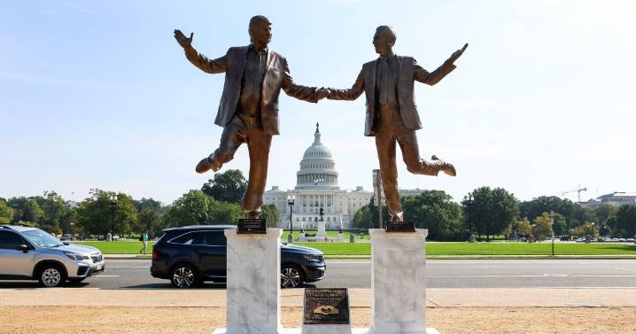 A statue of Trump and Epstein holding hands in D.C. is removed as fast as it appeared