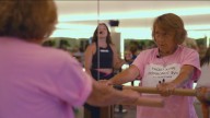 Paralyzed woman walks a mile, raises $1,000 for camper sponsorship