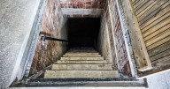 Woman stumbles across trapdoor while renovating home and takes peek inside