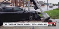 Car takes out traffic light at 50th, NW Radial