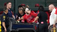 Angels' Taylor Ward carted off field after crashing into scoreboard