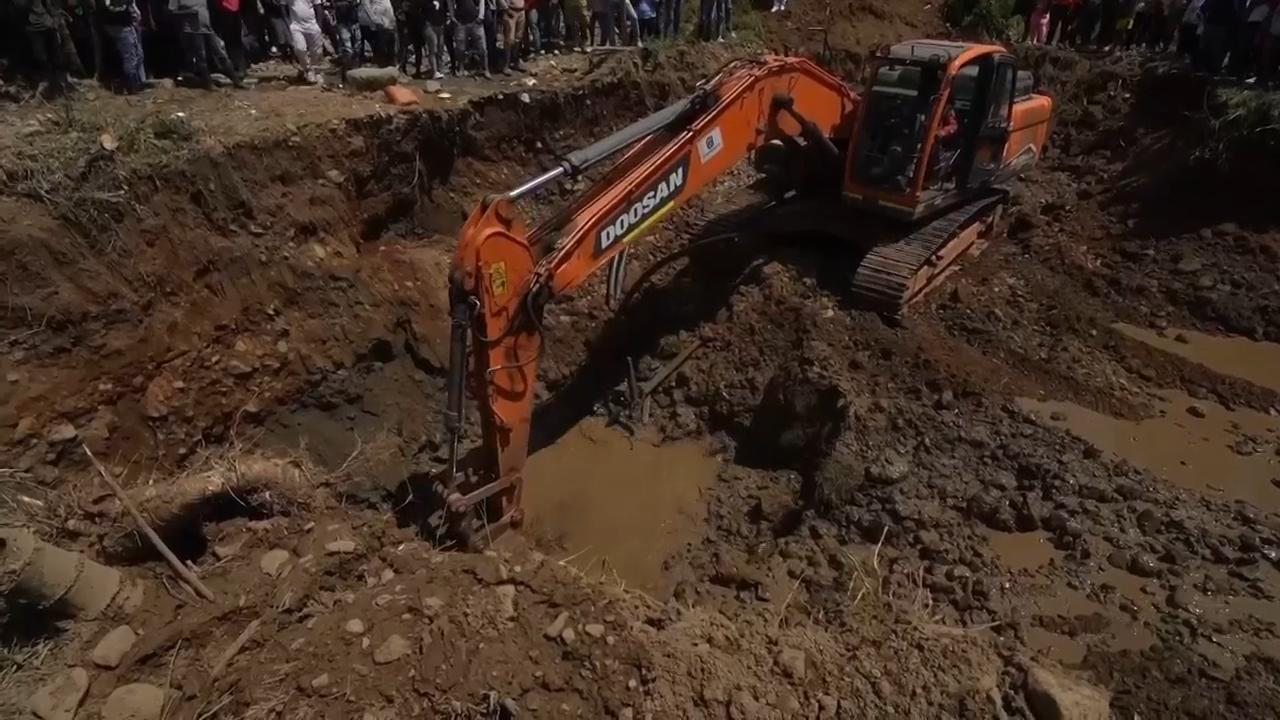 Search continues for workers trapped by collapse at illegal gold mine in Colombia
