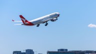 Qantas flight travelling from Sydney to Auckland forced to make emergency landing after concerns of fire on board